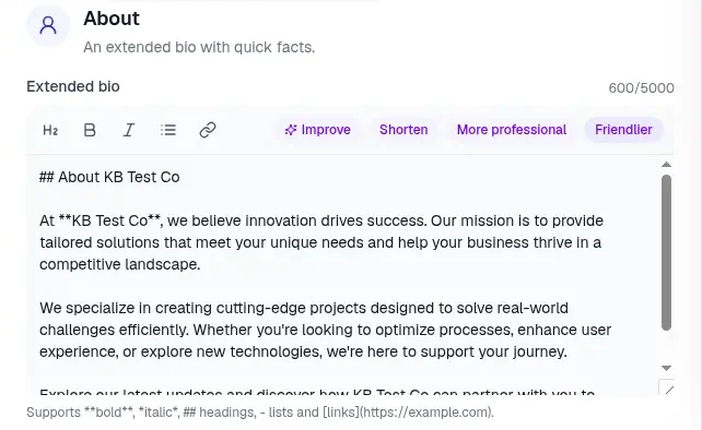The About tab in the profile editor with an AI suggested extended bio in the Extended bio box, a 600/5000 character counter, formatting buttons, and Improve, Shorten, More professional and Friendlier buttons above the text